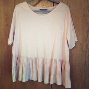 Light pink top with pleated bottom